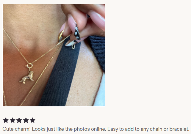 Customer wearing a gold dog charm on a necklace